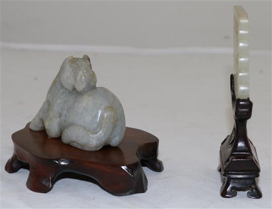 A Chinese pale celadon jade plaque, 18th / 19th century, 6.1cm, wood stand